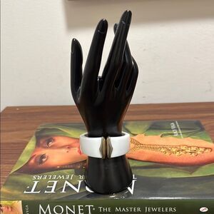 Vintage Monet Signed White Lucite Clamper Bracelet with GoldTone Accent.